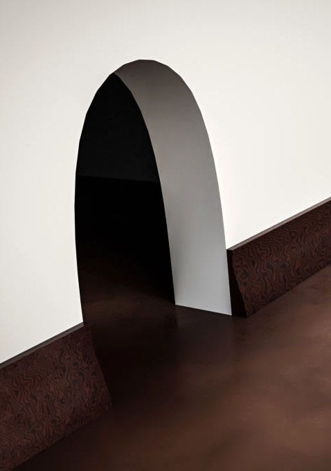 A neat mouse hole in a wall, like Tom & Jerry cartoon